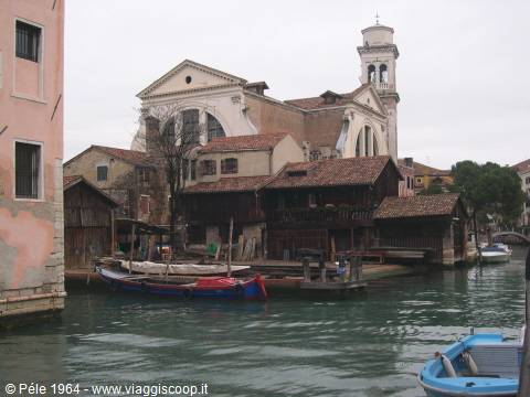 Squero di San Trovaso shipyard in Venice, wooden boats along the canal
