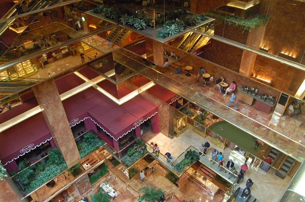 Trump Tower atrium in New York with marble balconies, burgundy awnings and escalators