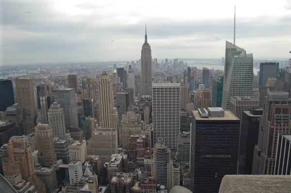 Manhattan skyscrapers with the Empire State Building under a cloudy sky