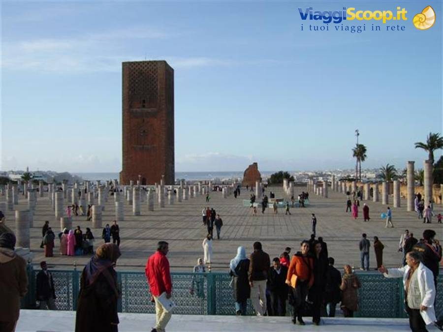 Tourists on the Hassan Tower esplanade in Rabat, stone columns and blue sky