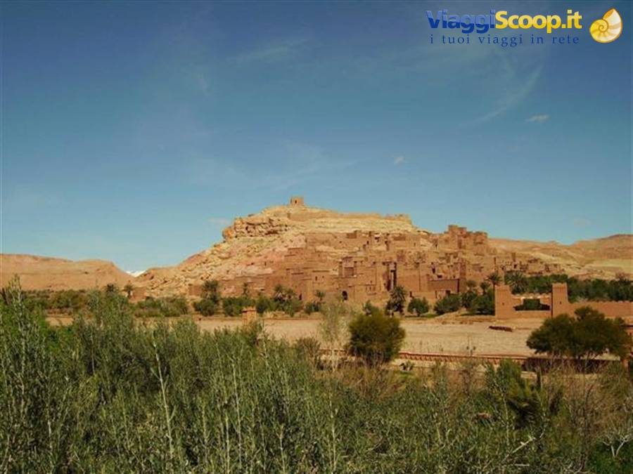 Aït Benhaddou village, red mud-brick houses among palms and greenery
